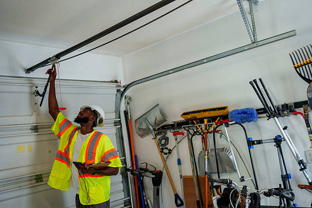 Professional Garage Door Panel Replacement technician working in Glens Falls, NY